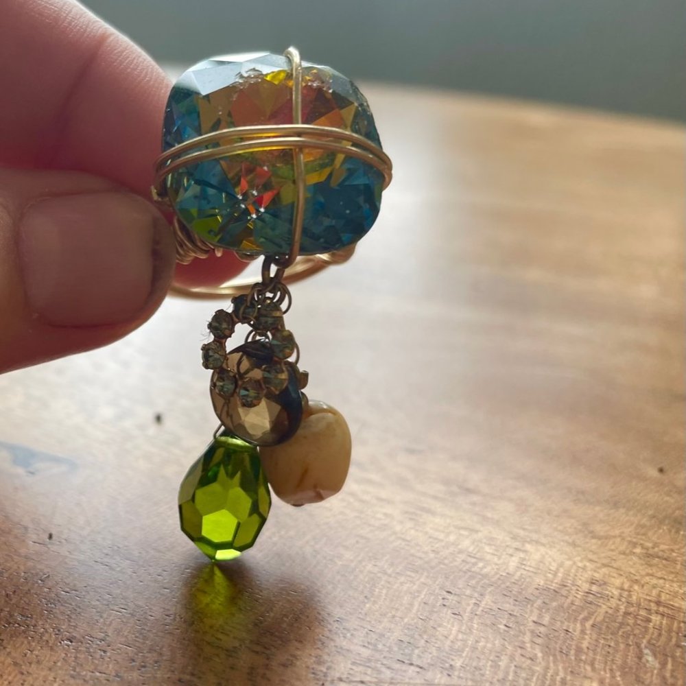 Ring with dangling charms.